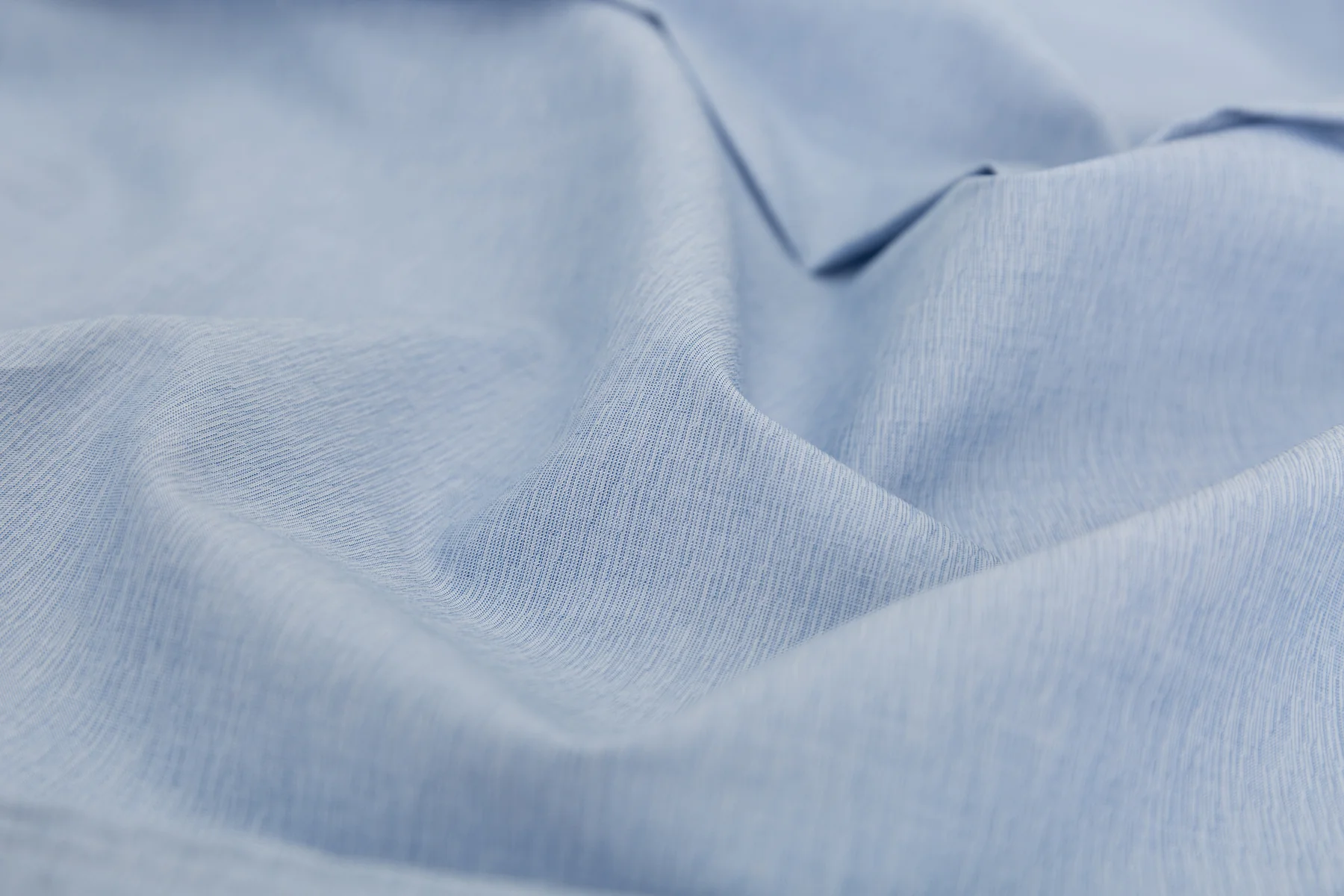 Close-up of light blue shirting fabric texture