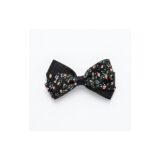 Black ditsy floral ribbon bow hair clip on white background view 1