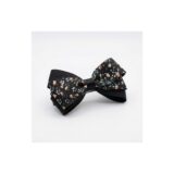Black ditsy floral ribbon bow hair clip on white background view 2