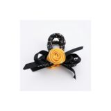 Golden rose black ribbon hair clip on white background view 1