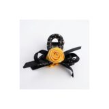 Golden rose black ribbon hair clip on white background view 2