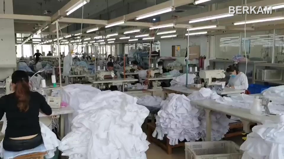 Sewing workstations and garment panels in BERKAM’s shirt workshop